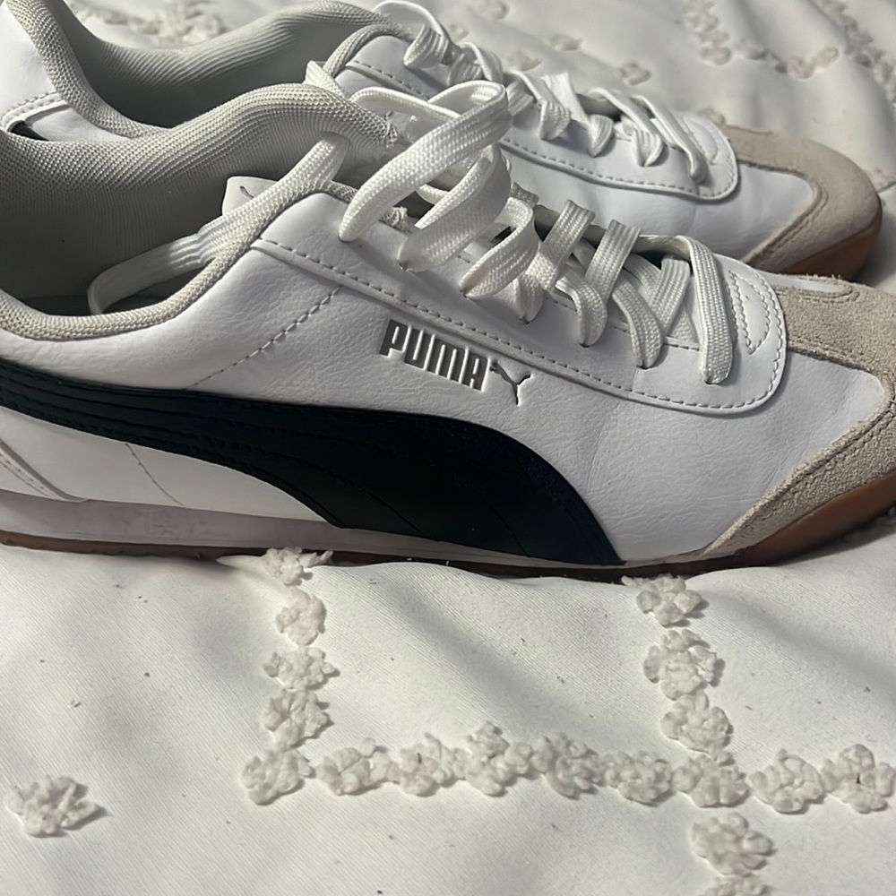 Men’s black and white Puma sneakers